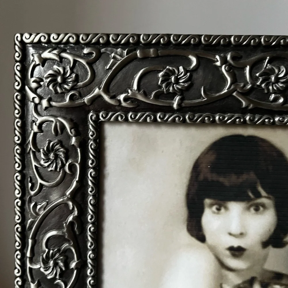 Large ornate silver Frame for photo 8”x10” free standing..